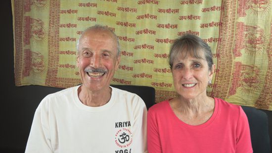 A picture of Lisa and Kenny doing the radio talk show titled Pitfalls of Humanizing the Christ.