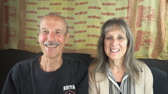 A picture of Lisa and Kenny doing the podcast titled Unveiling the Omnipresent Divine Truth.